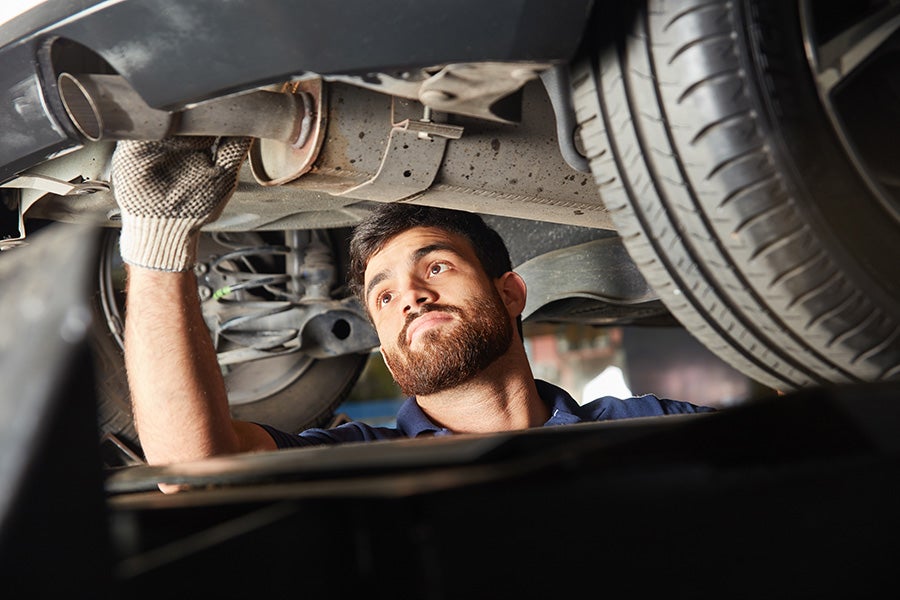 mechanic working on a vehicle - Gandrud Chevrolet in Green Bay WI